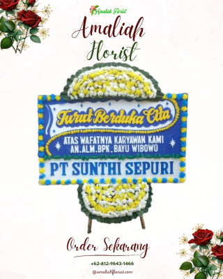 Papan Bunga Duka di Kepala Madan
